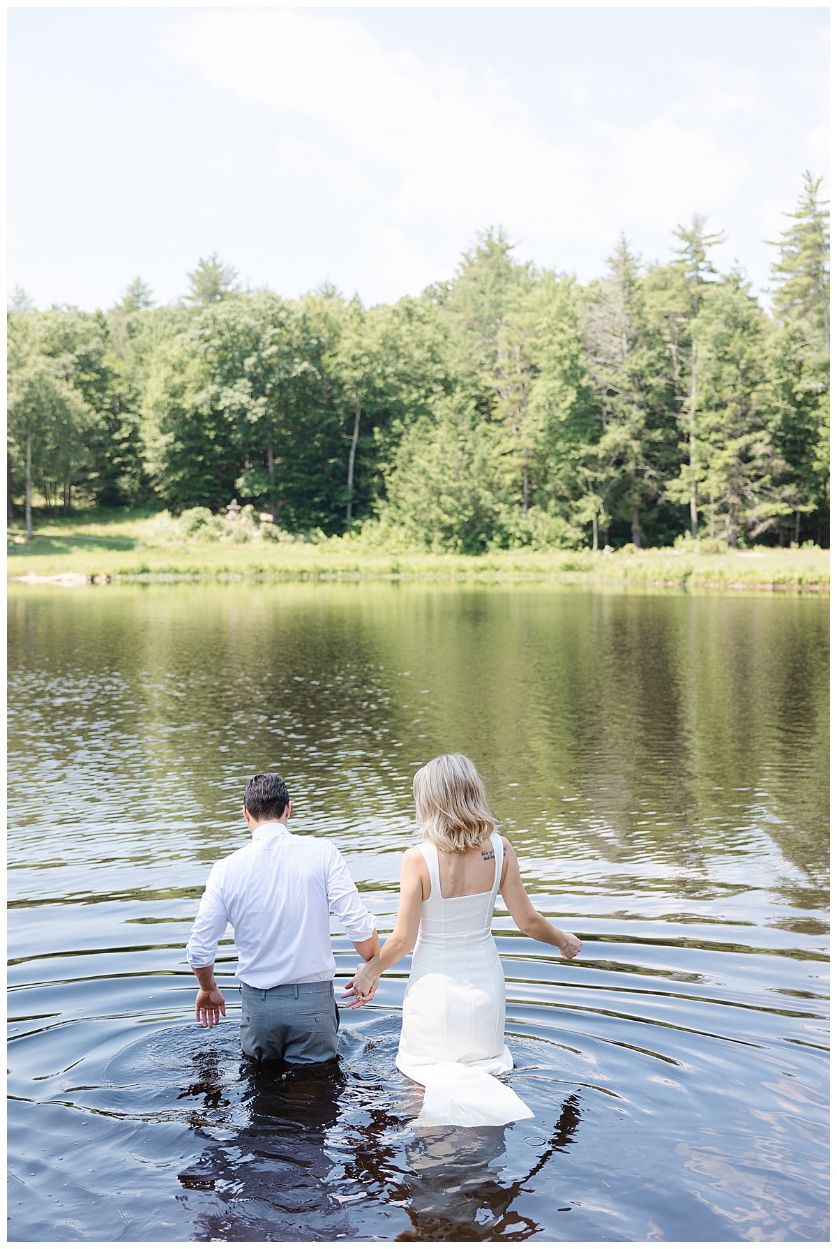 Bride in Groom in pond in NH