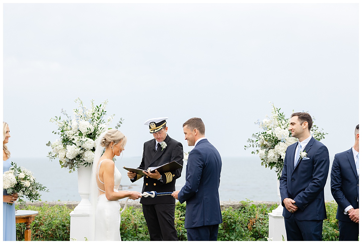 bride and groom tying the knot